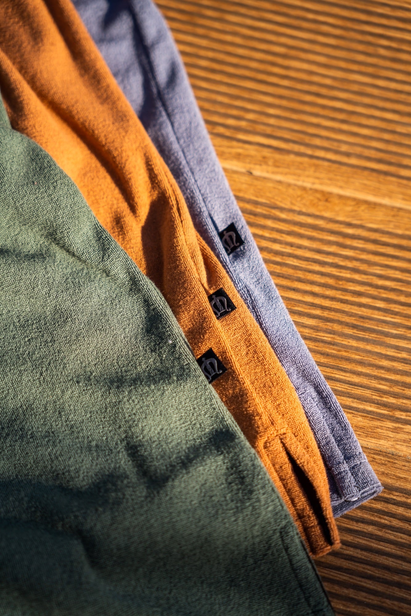 THE PALM TOWELLING POLO SHIRT IN TANGERINE